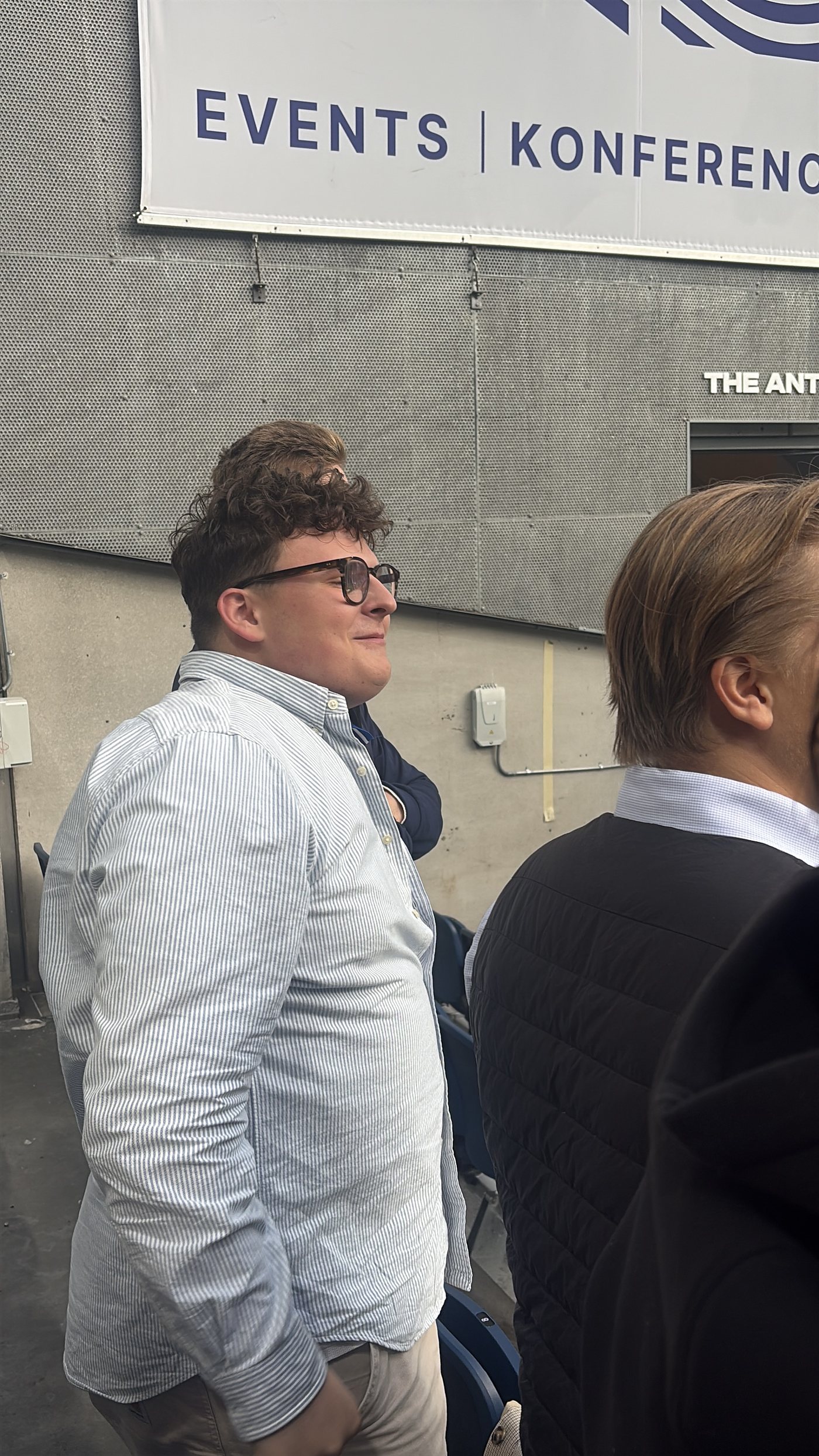 Two colleagues talking outside a conference