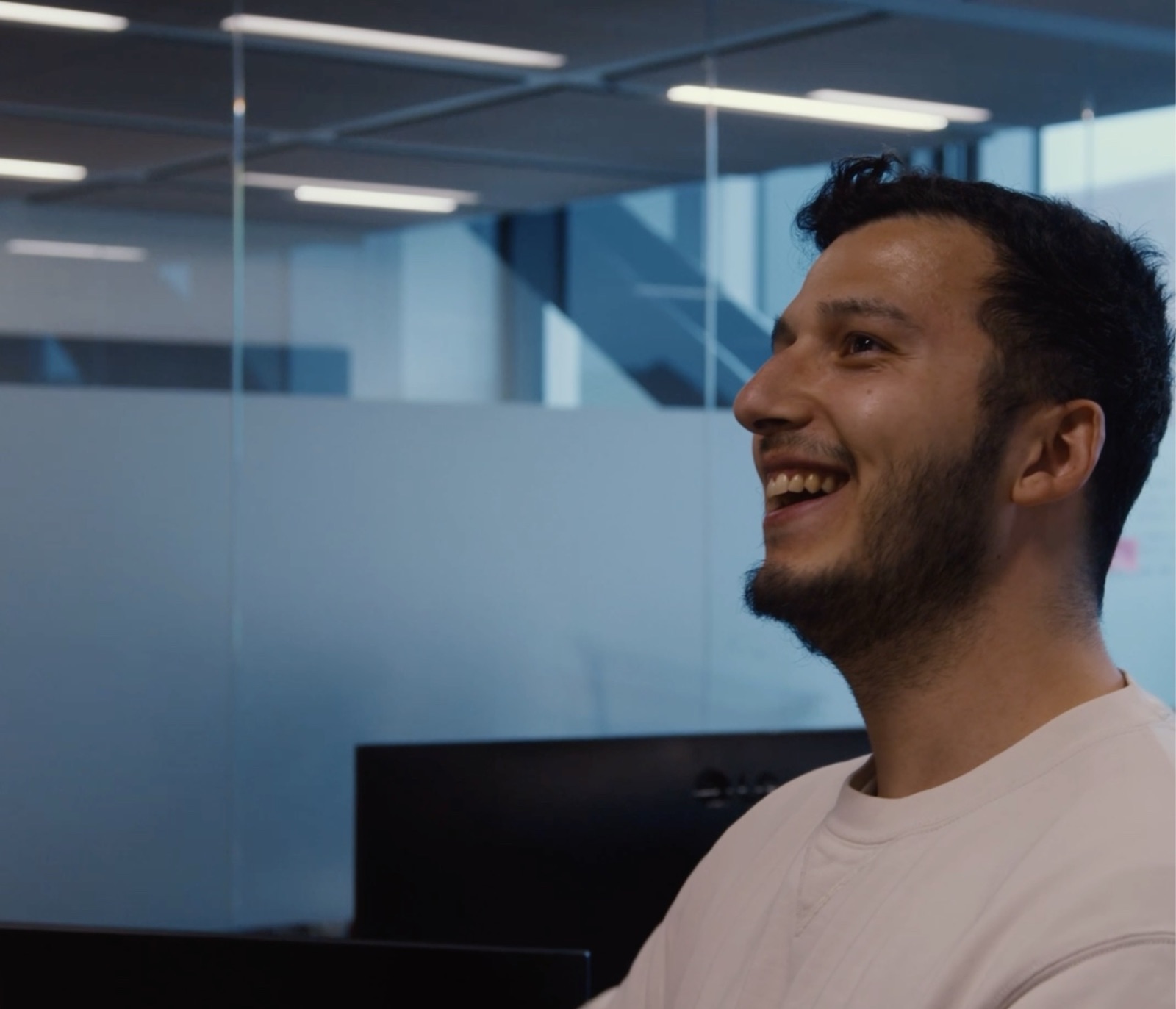 A Fullview employee laughing mid-conversation