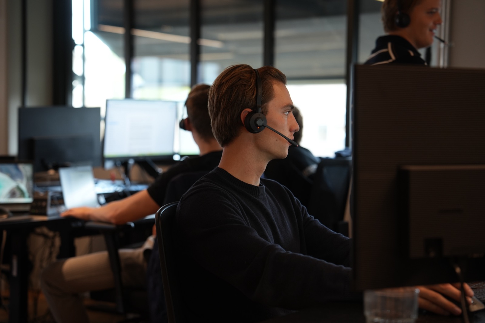 An SDR on a call, focused on the screen
